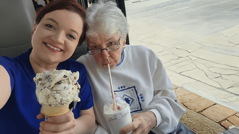 senior getting ice cream with an employee